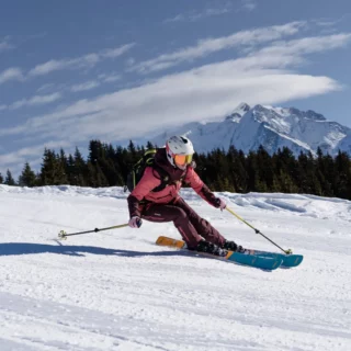 Ski instructor teaching beginners to ski on snowy slopes in Chamonix