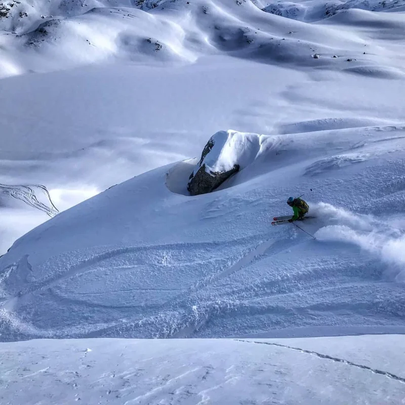 Children participating in a fun and safe ski lesson with a professional guide