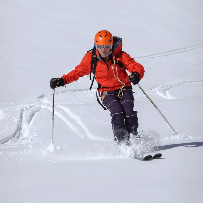 Group ski lesson on powder snow led by an experienced IFMGA instructor