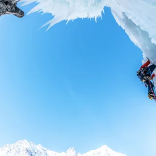 Ice climbing route in the Chamonix Valley with an IFMGA guide leading a beginner climber.