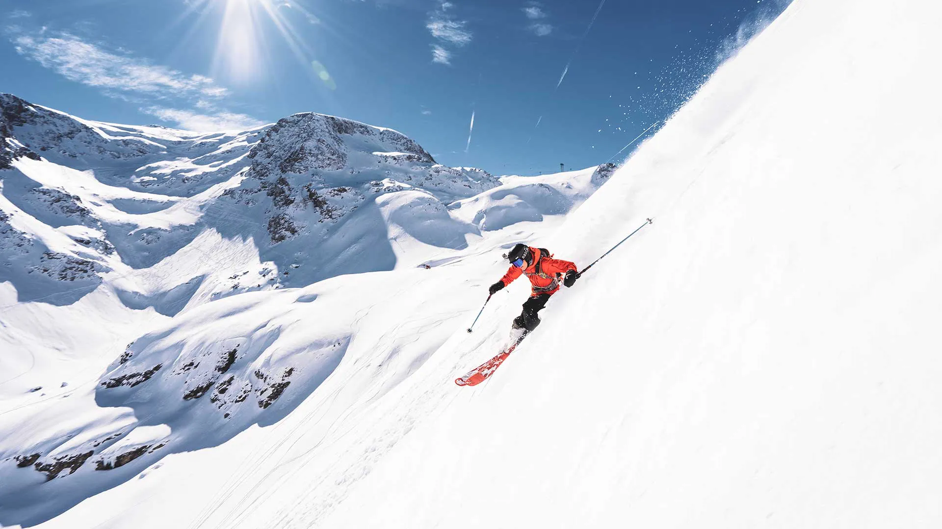 Skier descending a powder face in the Verbier freeride area