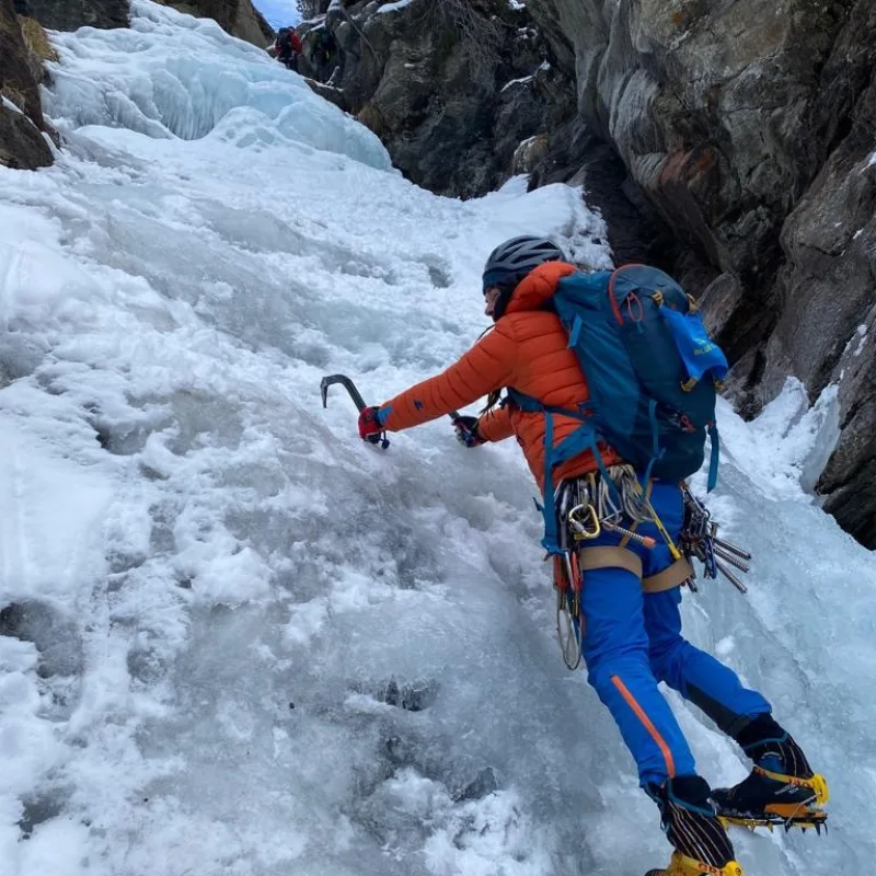 Ice climbing in Valnontey with an IFMGA guide providing technical instruction.