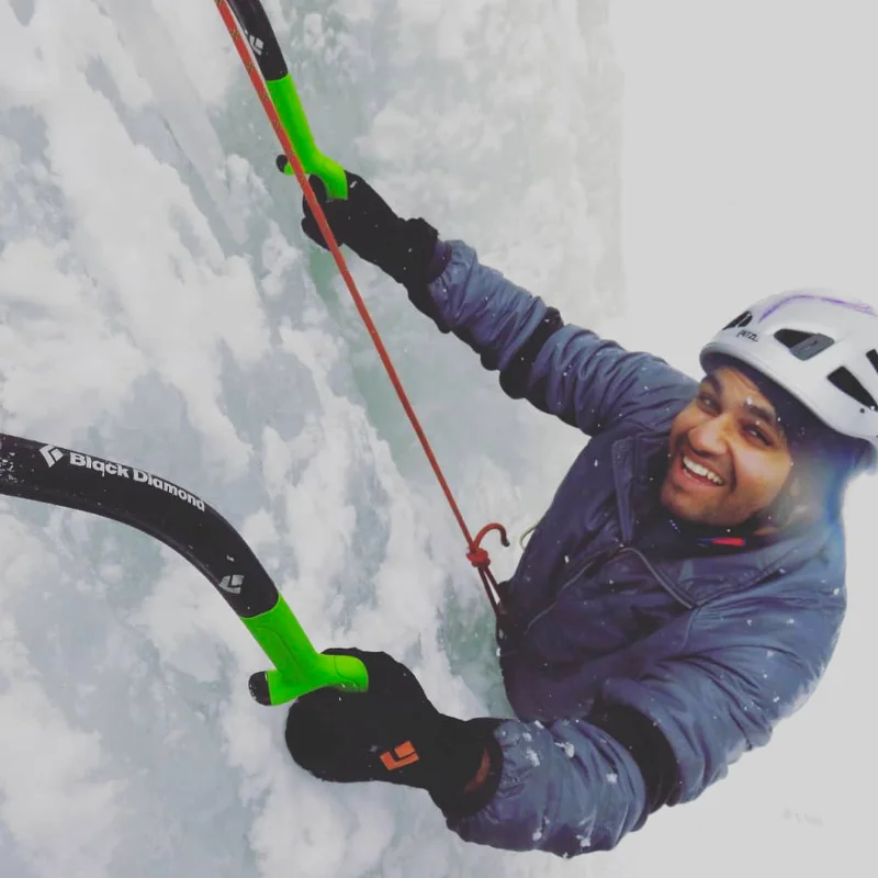 Alpinists climbing the ice lines on the Argentière Glacier with a view of the Mont Blanc massif.