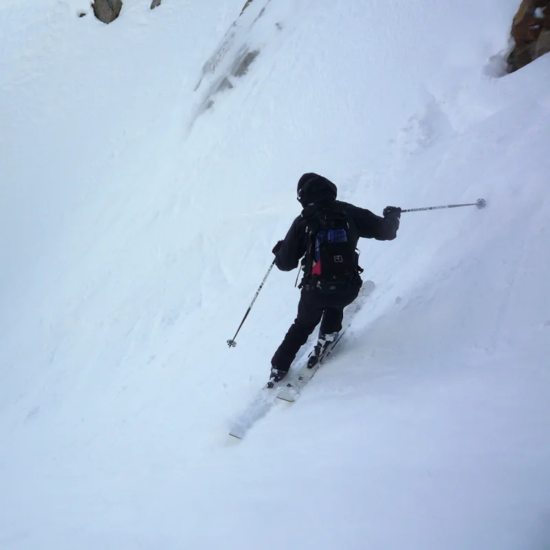 Skier skiing couloir in the Aosta Valley