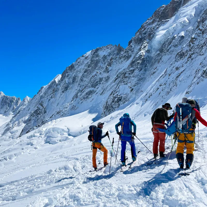 Skiers traveling through remote valleys on the Chamonix to Zermatt route