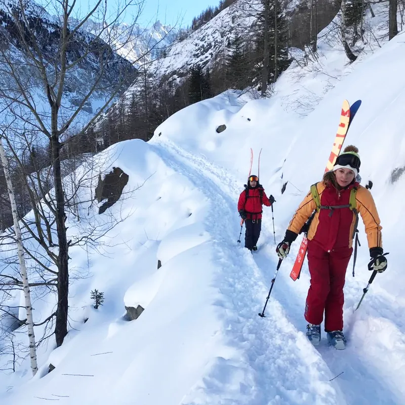 Ski mountaineers traveling across remote alpine terrain