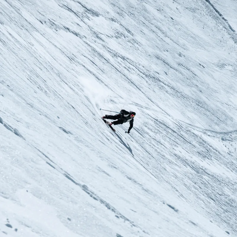 IFMGA guide leading a group down a Verbier backcountry run