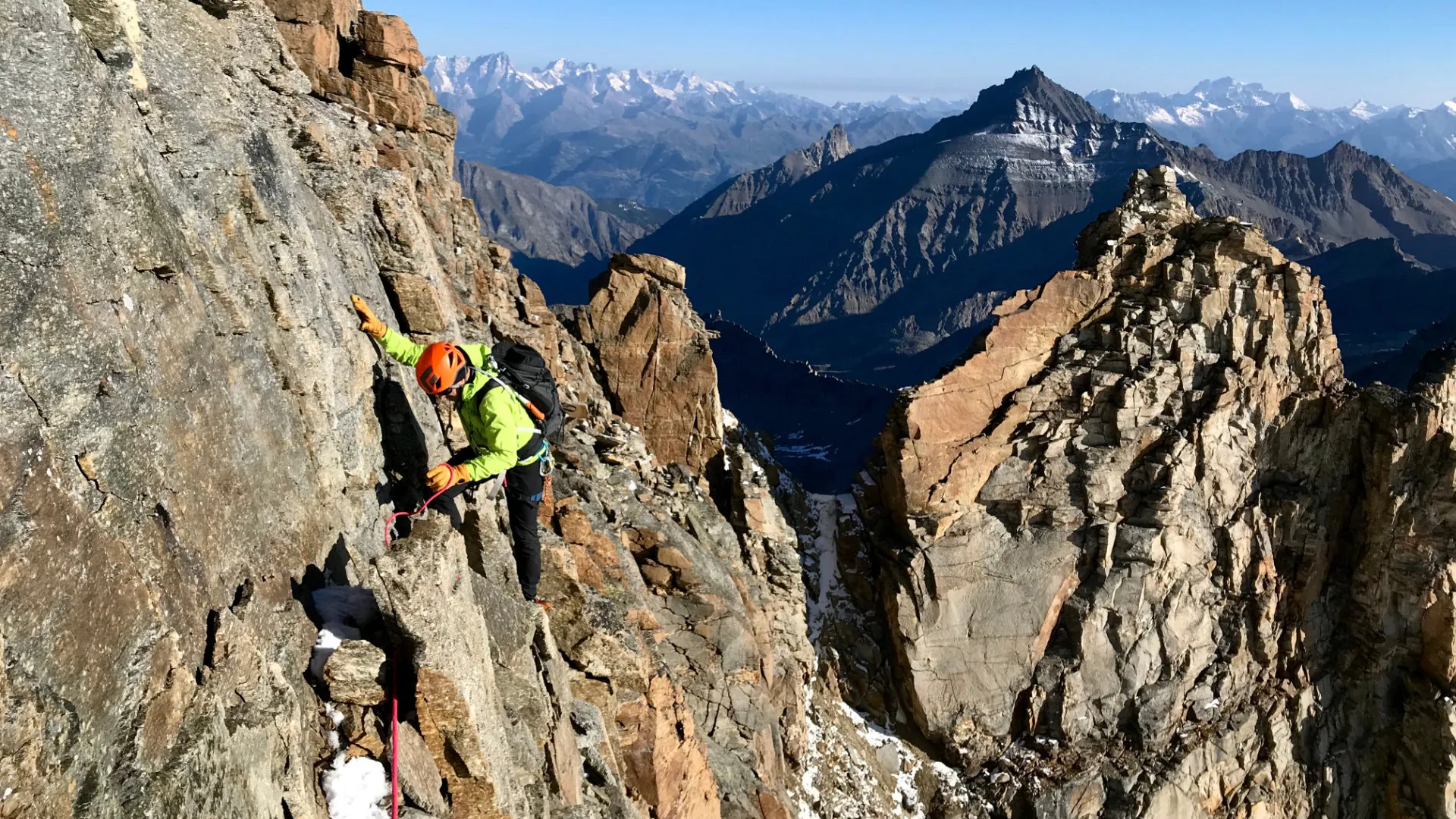 Climber on a high-altitude peak outside France