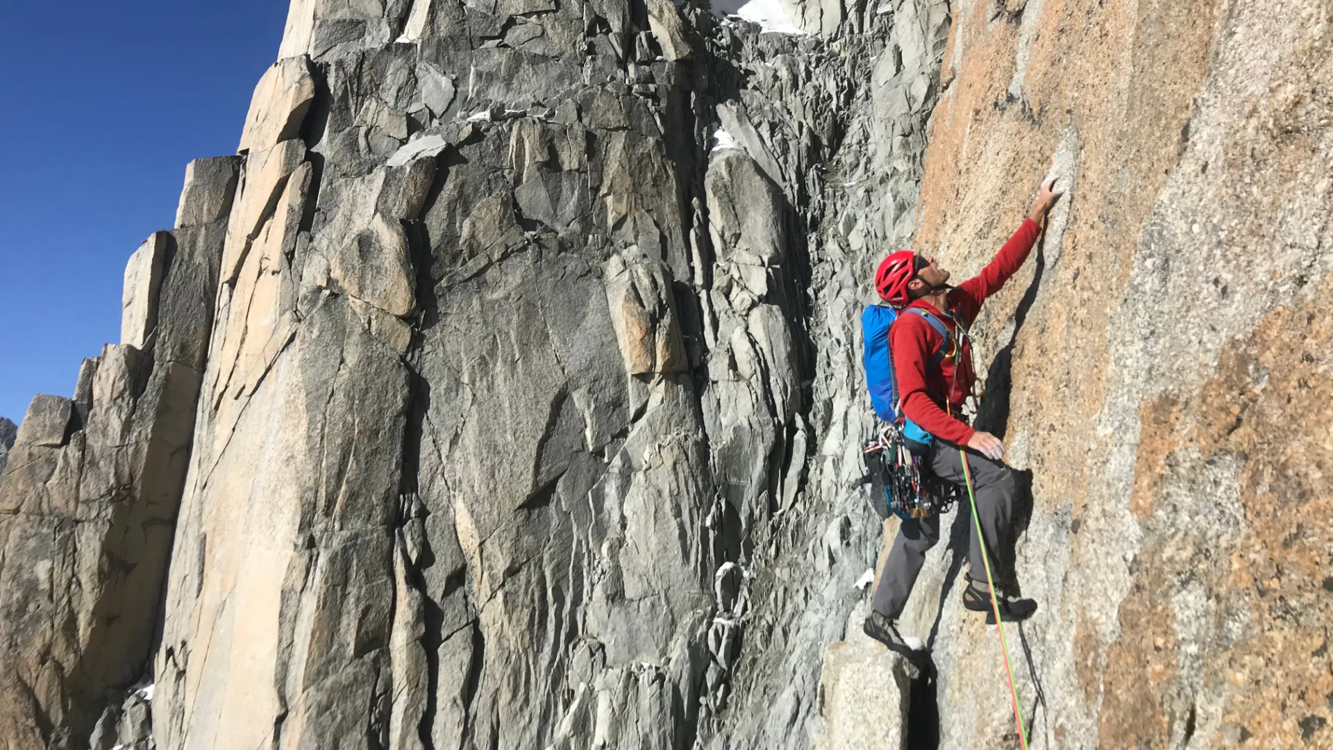 Climber ascending a famous Chamonix rock face