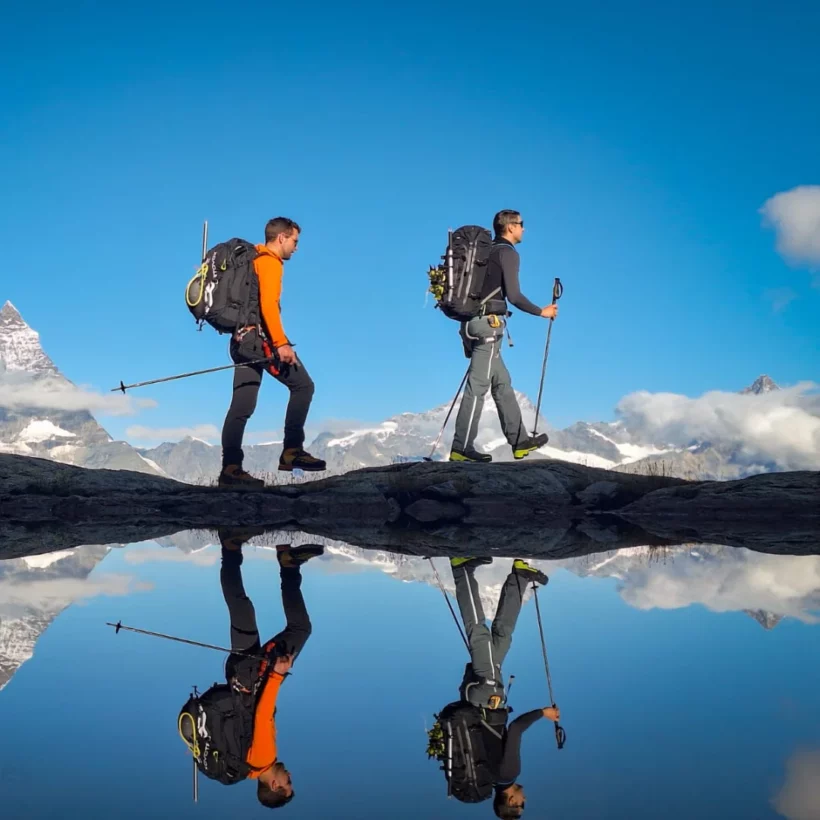 IFMGA guide leading clients on a summer mountain adventure
