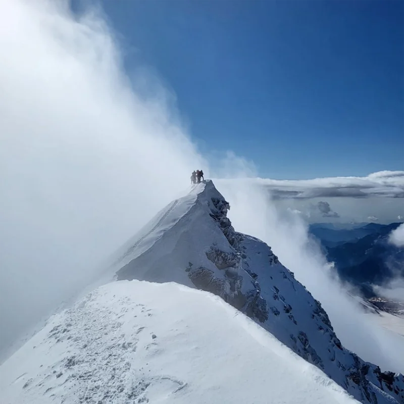 Alpine summit climb in a remote mountain range