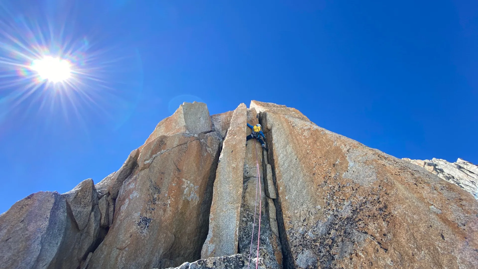 Climber ascending a granite wall in Chamonix